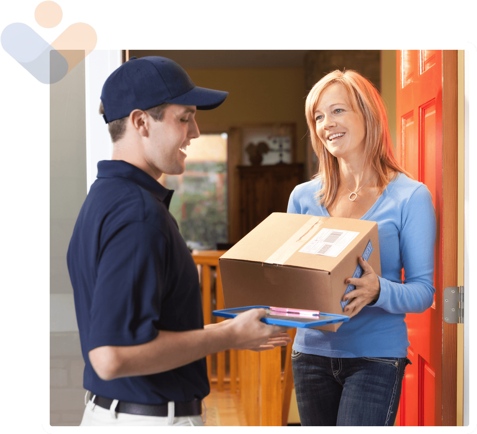 Delivery person handing package to smiling woman.