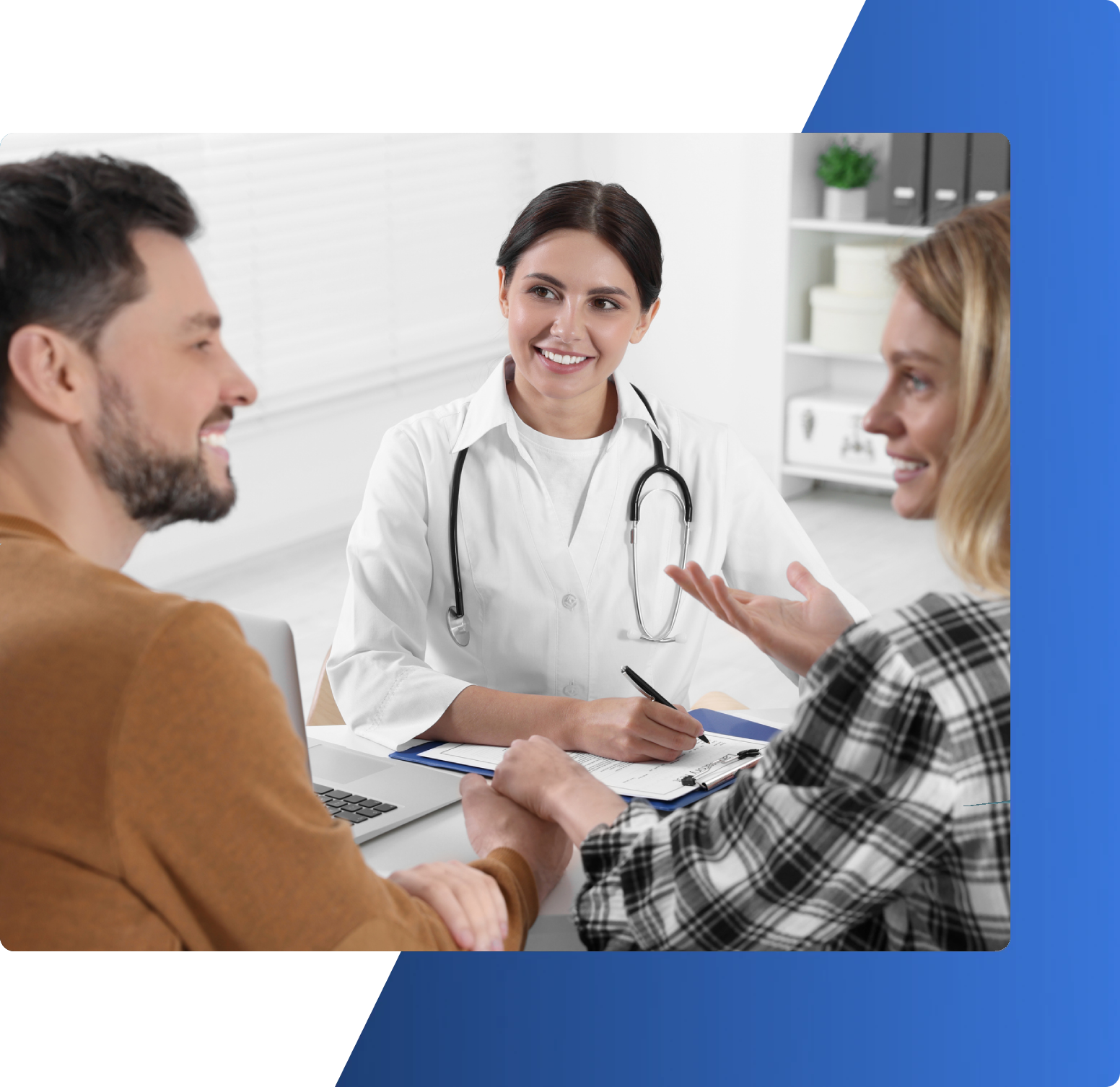 Doctor consulting with a smiling couple.
